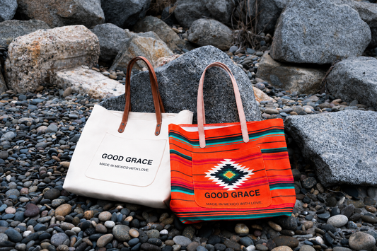 Good Grace totes made in Mexico, on the rocks by the sea